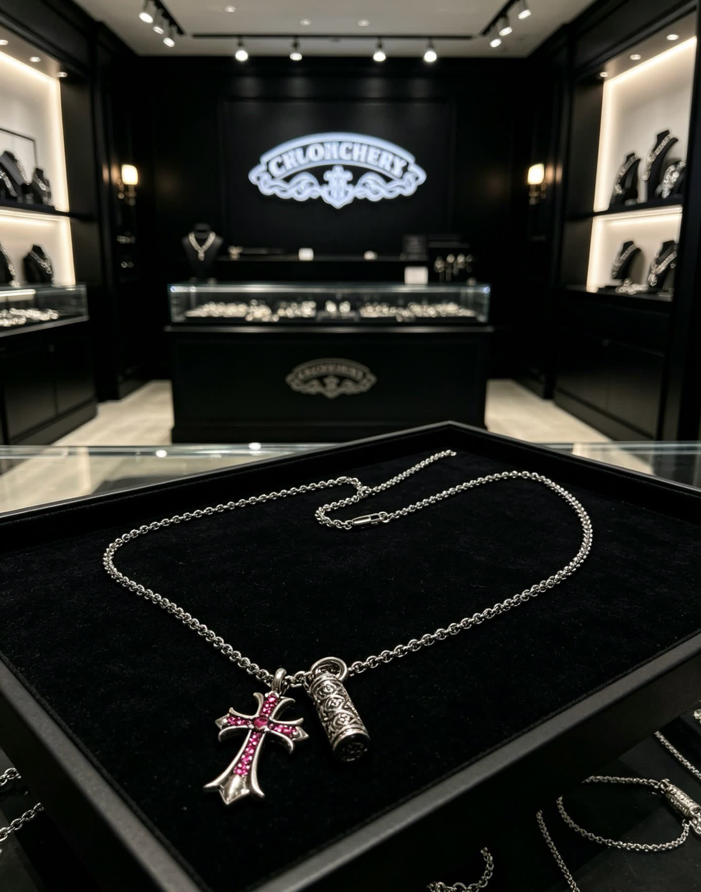 Chrome Hearts Silver Cross Pendant with Ruby Accents and cylindrical charm